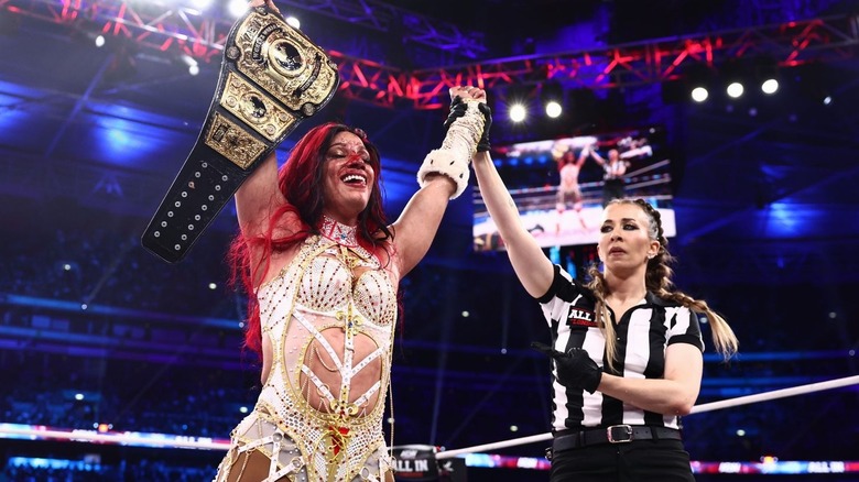 Mercedes Moné holding up the AEW Women's World Championship