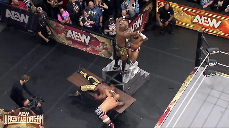 The Demand sending Benjamin crashing on top of Lashley on the outside