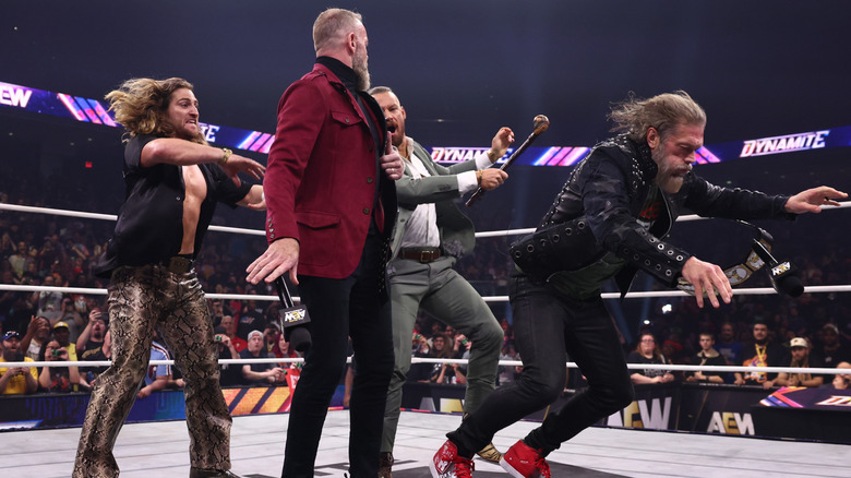 The Dogs' Clark Connors and David Finlay attack AEW World Tag Team Champions Christian Cage and Adam Copeland from behind during their championship celebration on an episode of "AEW Dynamite."