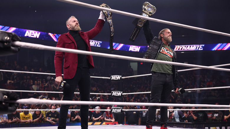 Christian Cage and Adam Copeland hold up their AEW World Tag Team Championships during a celebration in the ring on the May 27, 2026 edition of 