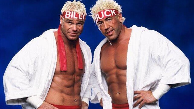 Billy Gunn and Chuck Palumbo posing together in white robes during their "Billy & Chuck" run in WWE.