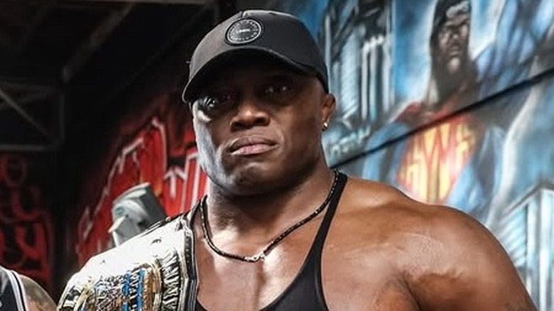 Bobby Lashley poses with his AEW World Tag Team Championship
