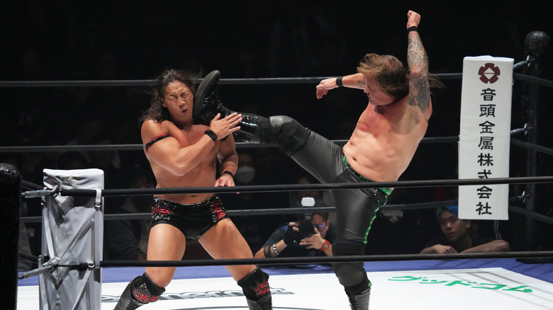 Chris Jericho boots Konosuke Takeshita right in the face