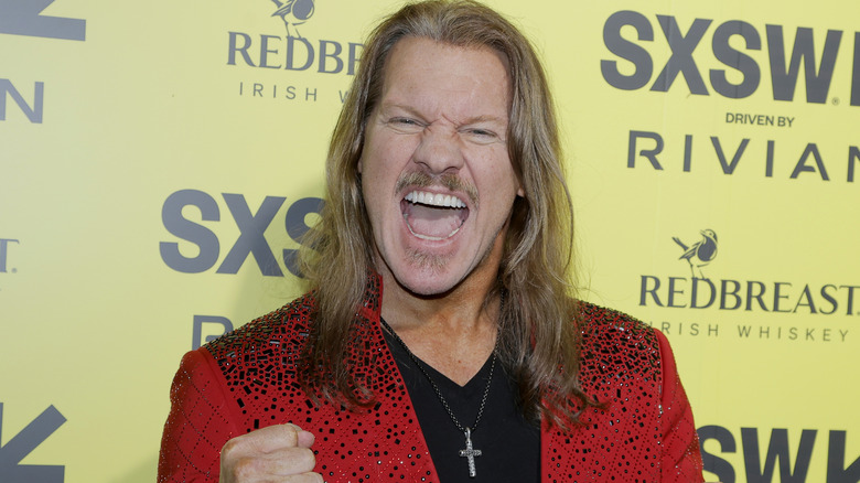 Chris Jericho wearing a red jacket