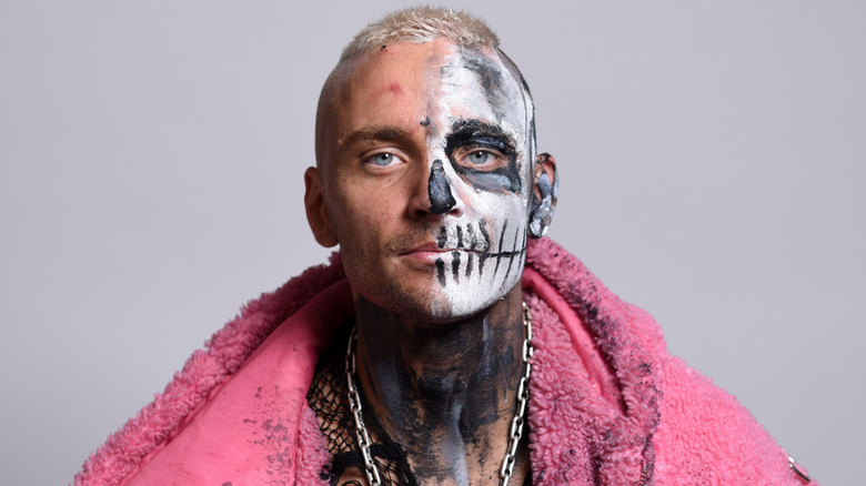 Darby Allin wearing a pink jacket