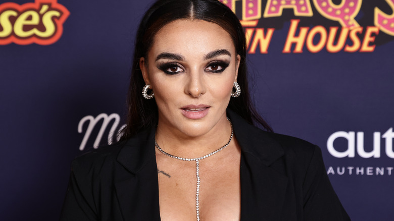 Deonna Purrazzo wearing silver hoop earrings