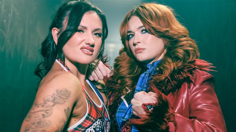 Alex Windsor and Jamie Hayter posing together for a promotional shoot as 