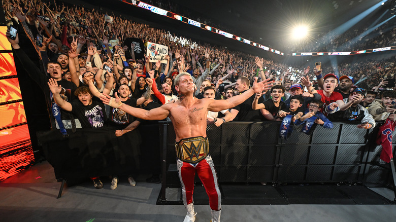 Cody Rhodes posing in front of fans at WWE Backlash