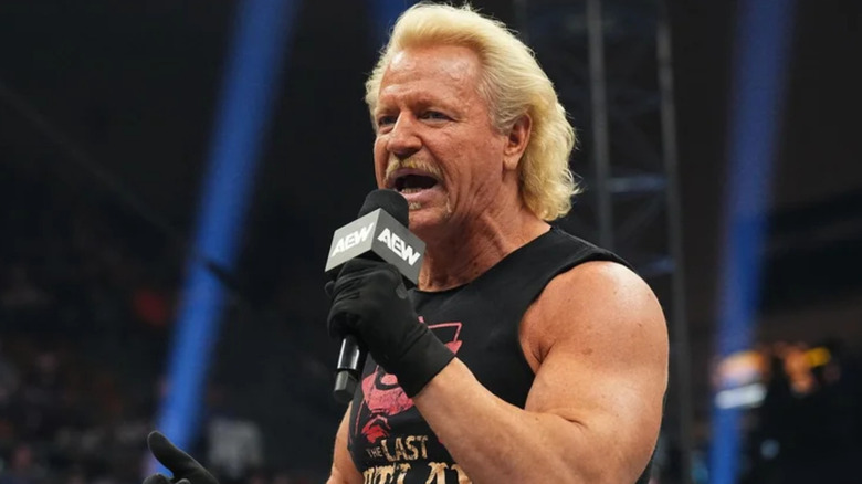 Jeff Jarrett holding a microphone