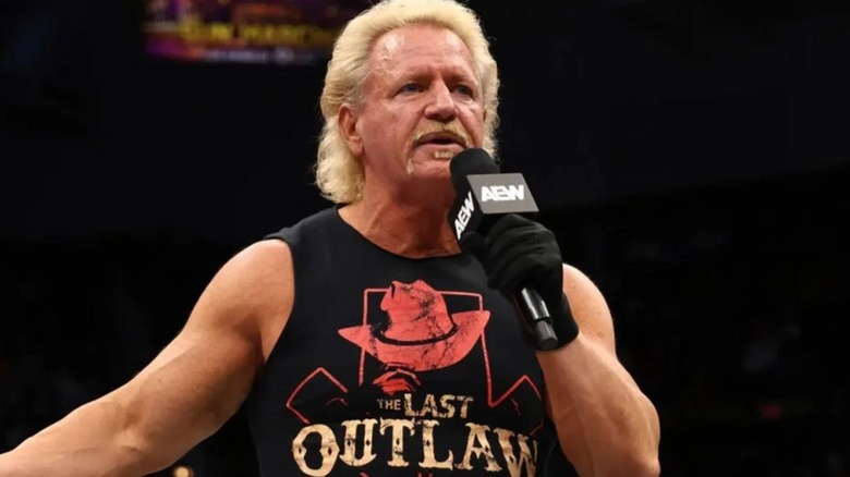 Jeff Jarrett holding a microphone