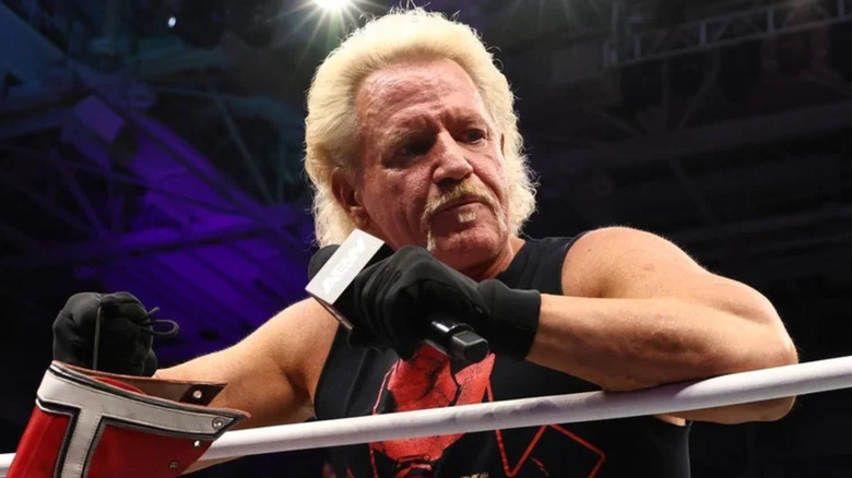 Jeff Jarrett holding a microphone