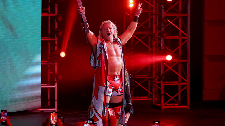 Jeff Jarrett holding up a guitar making his entrance