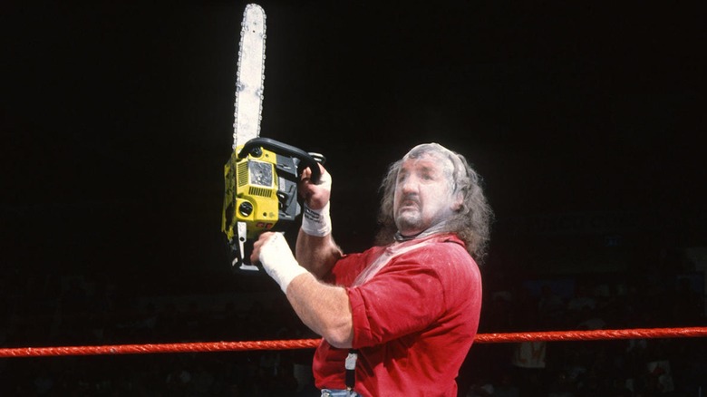 Terry Funk performs as Chainsaw Charlie in WWE