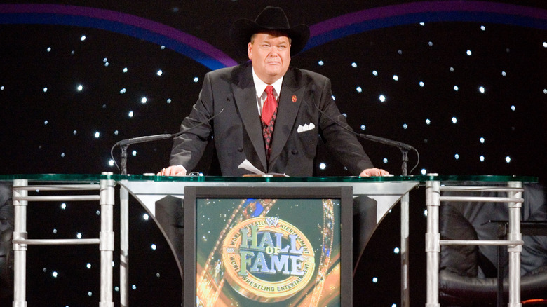Jim Ross standing at a podium