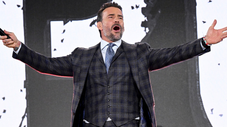 CM Punk beckoning the crowd during his appearance at the Fanatics Fest NYC, 2025.
