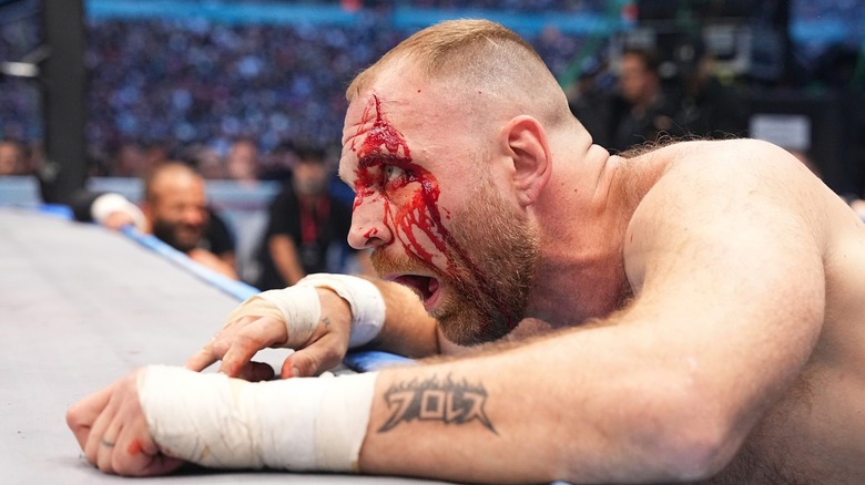 A bloodied Jon Moxley looking ahead