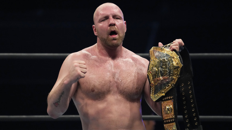 Jon Moxley poses with title