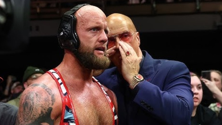 Don Callis whispering to Josh Alexander
