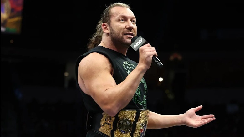 AEW International Champion Kenny Omega speaks to the crowd