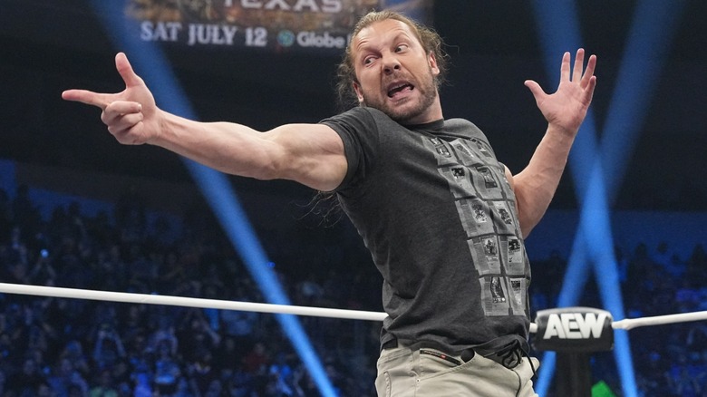 Kenny Omega performing his signature pose in the ring during an episode of "AEW Dynamite."