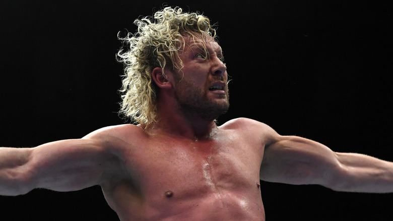 Kenny Omega posing