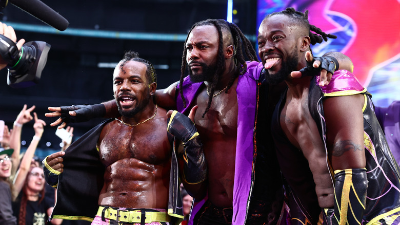Austin Creed and Kofi pose alongside Swerve Strickland on the ramp ahead of their debut match in AEW, at AEW All In London 2026.