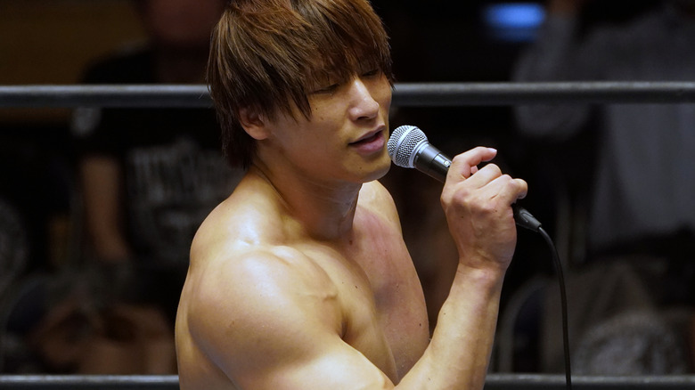 Kota Ibushi speaks on the microphone.
