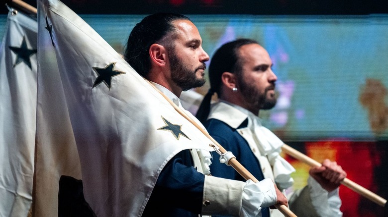 Matt and Nick Jackson carrying flags