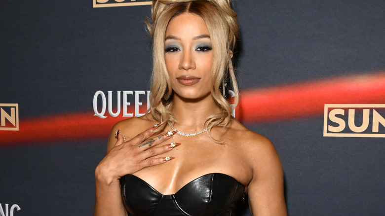 Mercedes Mone is wearing a black dress
