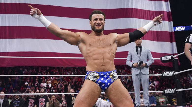 MJF posing in front of an American flag