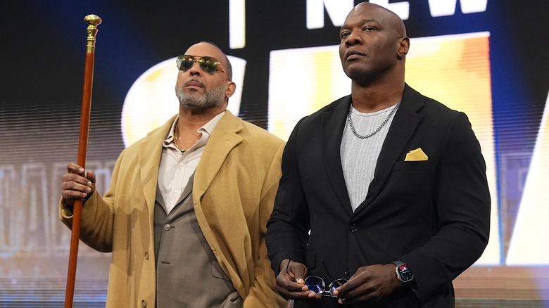 MVP and Shelton Benjamin at the top of the stage ramp staring at Jon Moxley and Josh Alexander during 