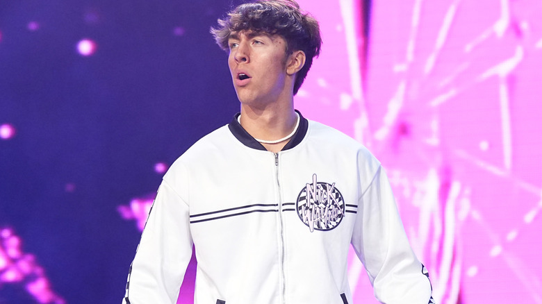 Nick Wayne wearing a white jacket