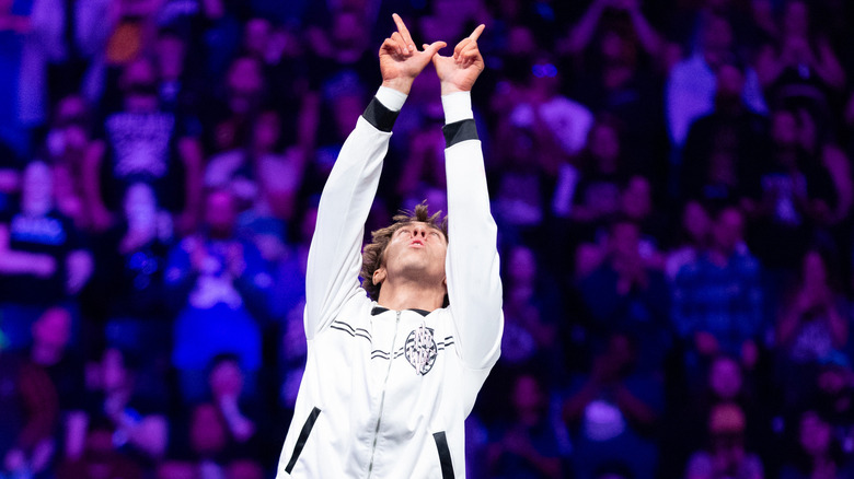 Nick Wayne posing on the top turnbuckle