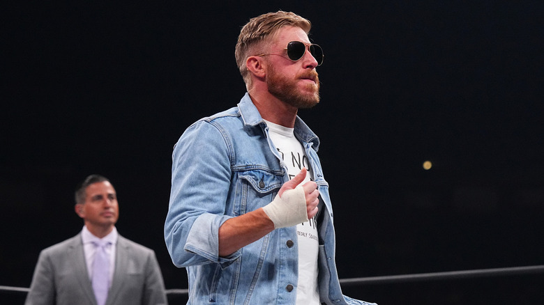 Orange Cassidy with his thumbs up in the ring 