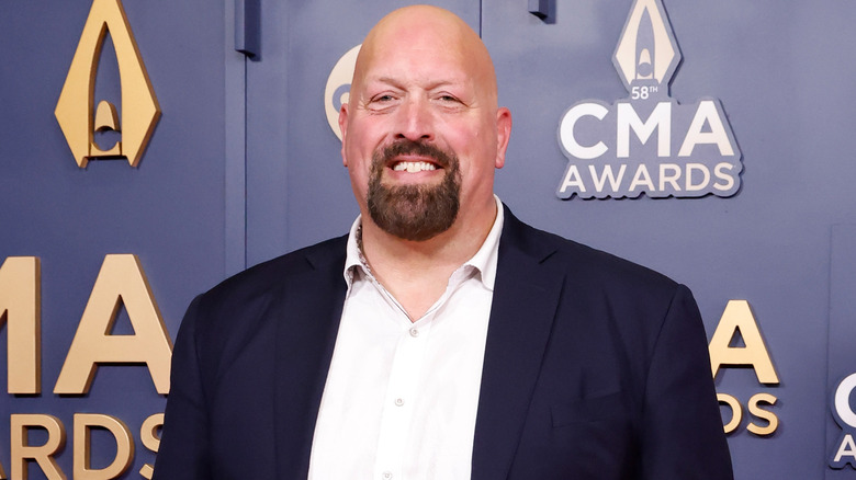 Paul Wight in a suit