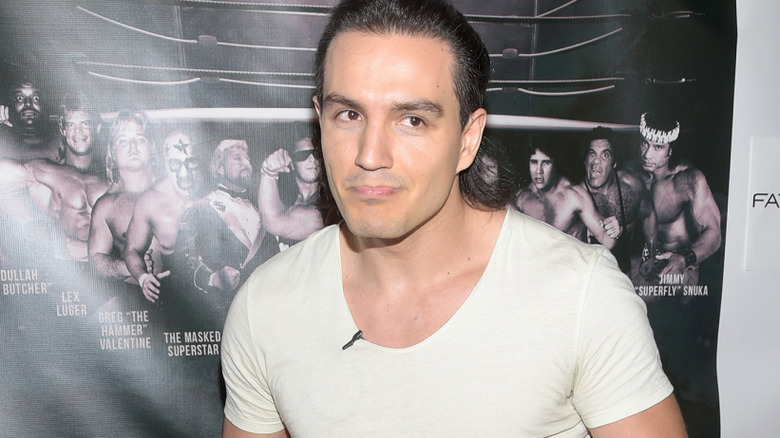 RJ City wearing a white t-shirt