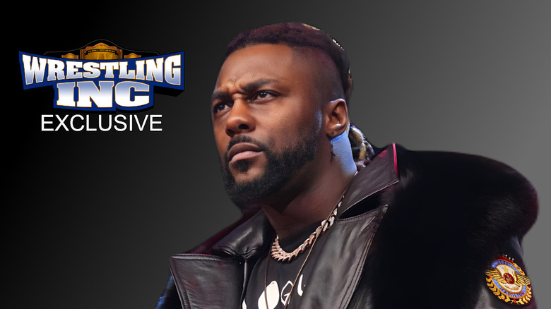 Swerve Strickland glaring at Wrestling Inc. logo