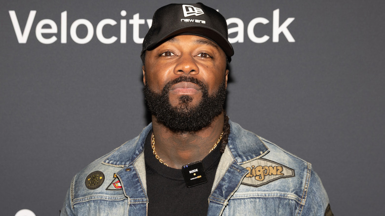 Swerve Strickland wearing a black baseball hat