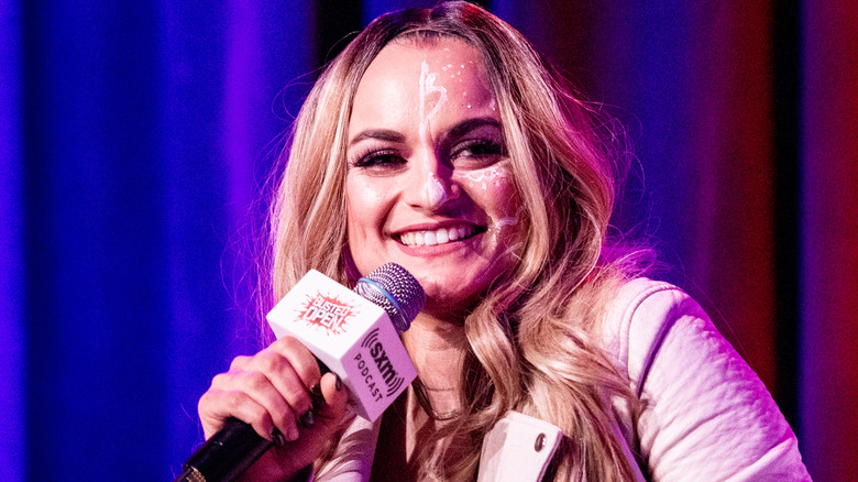 Thunder Rosa holding a microphone