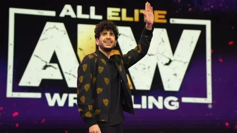 AEW President Tony Khan waves to the crowd during an AEW event
