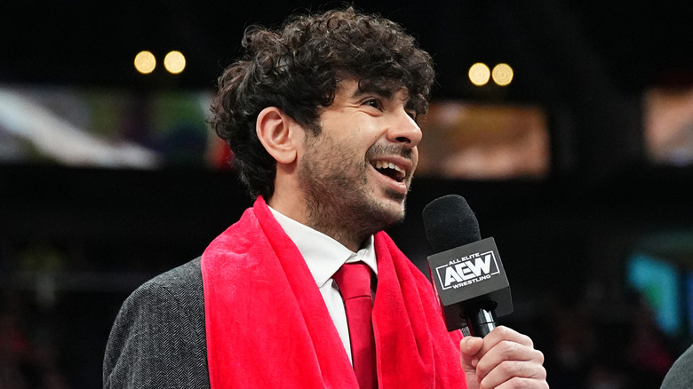 Tony Khan holding AEW microphone