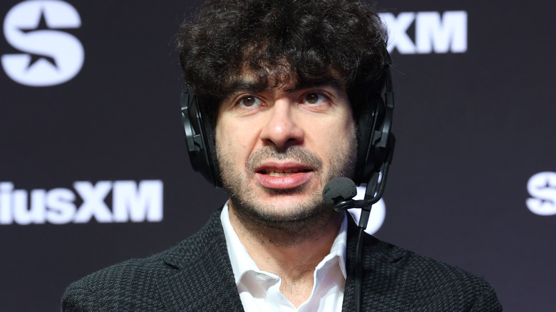 Tony Khan wearing a headset