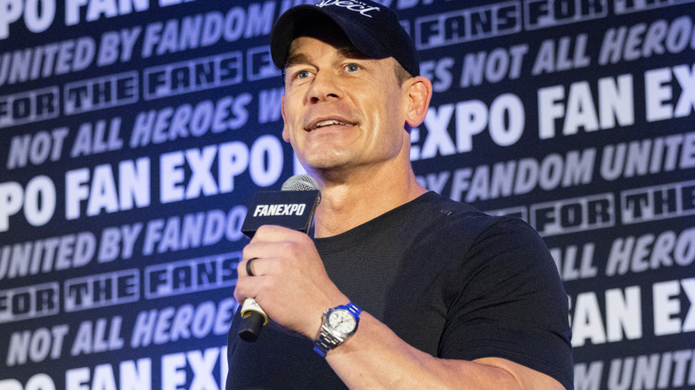 John Cena is holding a microphone