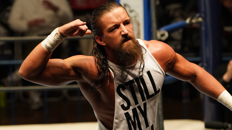 Jay White gives his signature switchblade pose ahead of a match