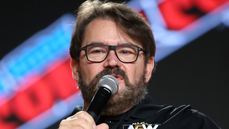 Tony Schiavone speaks into a microphone