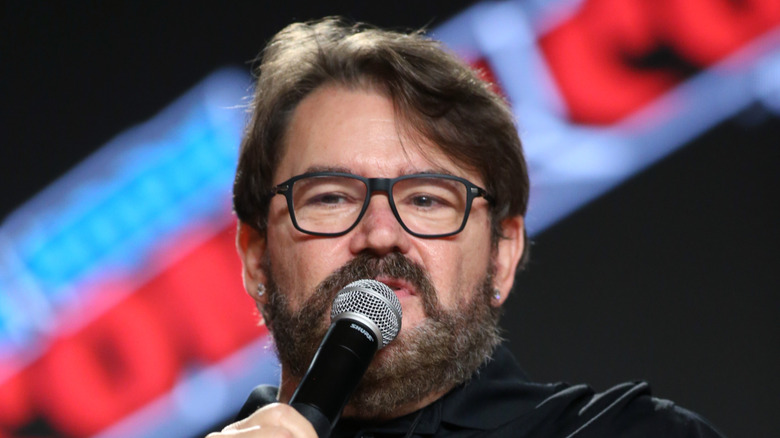 Tony Schiavone with a microphone