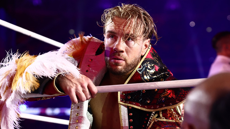 Will Ospreay hangs on the middle rope and looks toward the crowd during his entrance at AEW All In: London 2026.