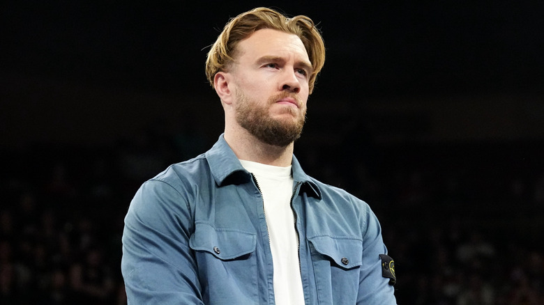 Will Ospreay standing in a wrestling ring