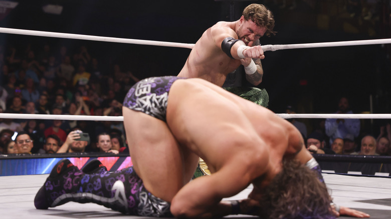 Will Ospreay gears up in the corner to hit a Hidden Blade on Ace Austin during a match on "AEW Dynamite."