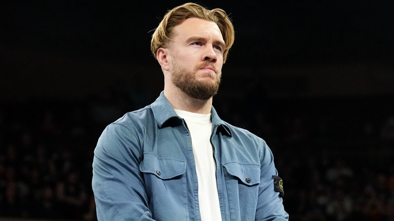 Will Ospreay stands in the ring and looks to the stage during a segment on 
